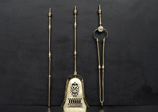 A set of brass Georgian style firetools