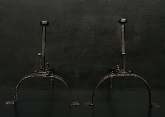 A pair a 18th century wrought iron firedogs