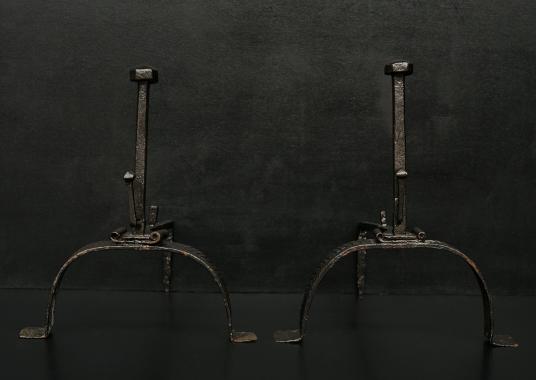 A pair a 18th century wrought iron firedogs