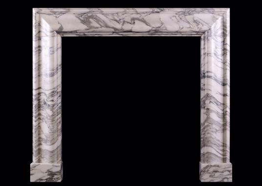 An English moulded bolection fireplace in Italian Arabescato marble