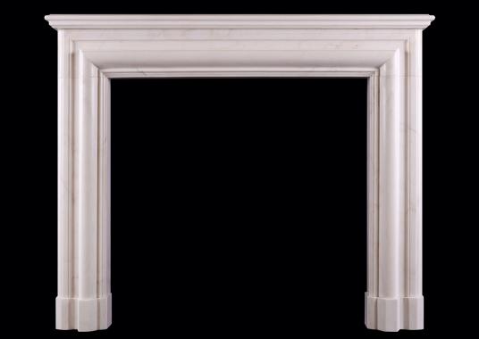 An English bolection fireplace in white marble