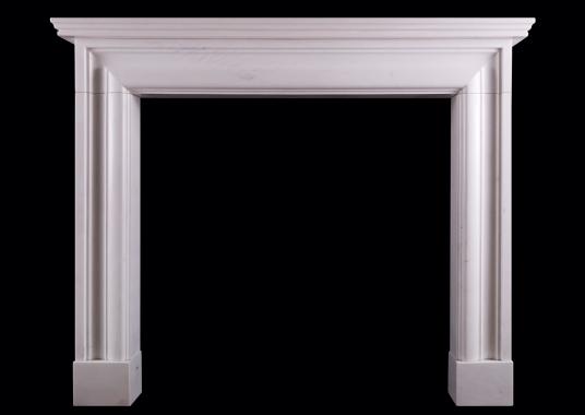 An English moulded bolection fireplace in white marble