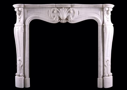 A French Carrara marble fireplace in the Louis XV style