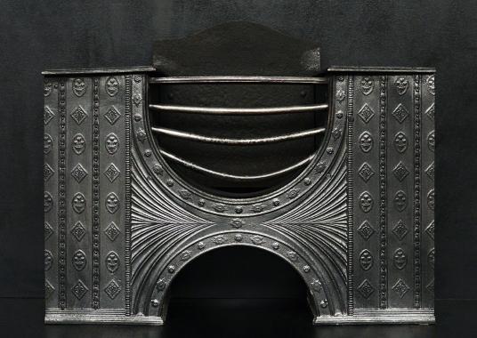 A decorative English hob grate