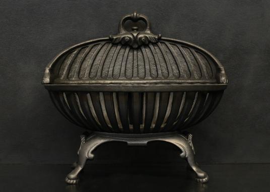 A Regency style cast iron firegrate