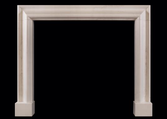 A white marble bolection fireplace