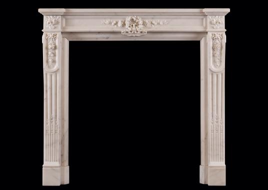 A Statuary white marble fireplace in the Louis XVI style