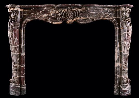 A French marble fireplace in Ribbon Campan marble