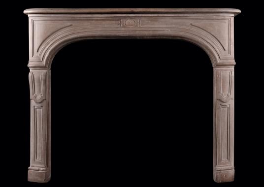A French limestone fireplace in the Louis XIV style