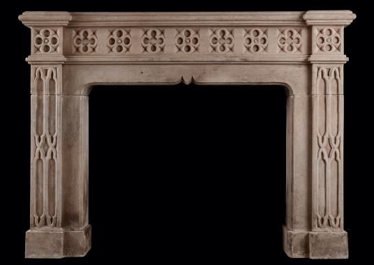 An English limestone fireplace in the Gothic Revival style