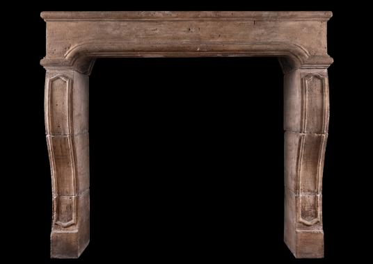 A period French Louis XIV limestone fireplace