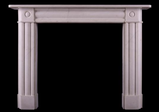 A white marble bullseye fireplace