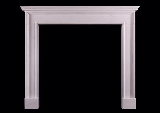 An architectural fireplace in white marble