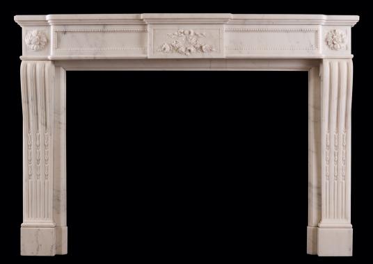 A French Louis XVI style fireplace in Statuary white marble