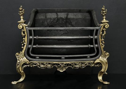 A brass and iron Rococo firegrate