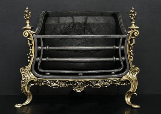 A brass and iron Rococo firegrate