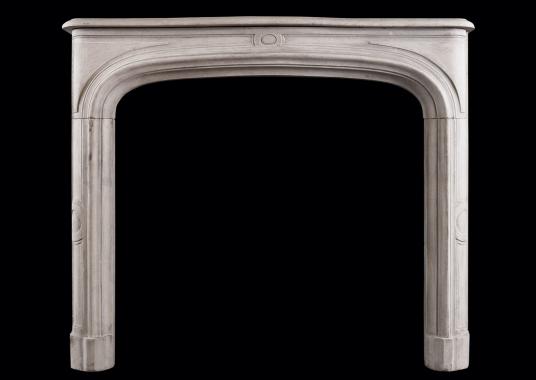 A French limestone fireplace in the Louis XIV style