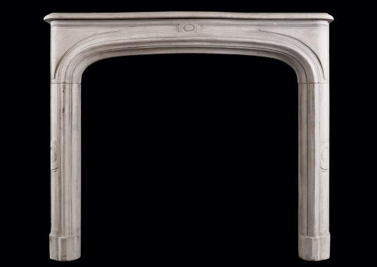 A French limestone fireplace in the Louis XIV style