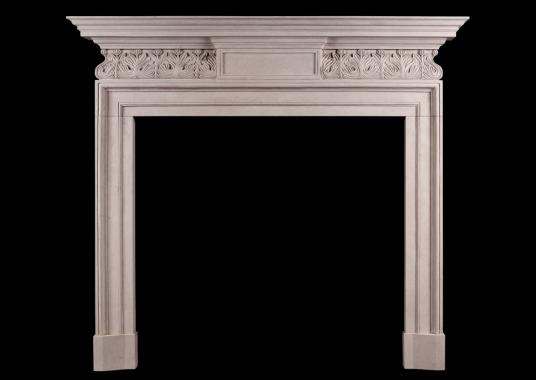 A GEORGE II STYLE STONE FIREPLACE WITH CARVED FRIEZE