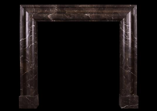 A stylish bolection fireplace in Emperador marble