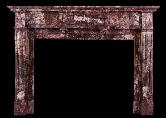 A 19th Century Louis XVI Fleur de Pecher marble fireplace