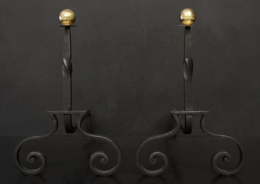 A pair of wrought iron firedogs