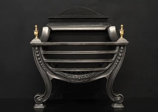 A polished cast iron Adam style basket