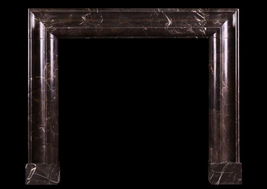 A stylish bolection fireplace in Emperador marble