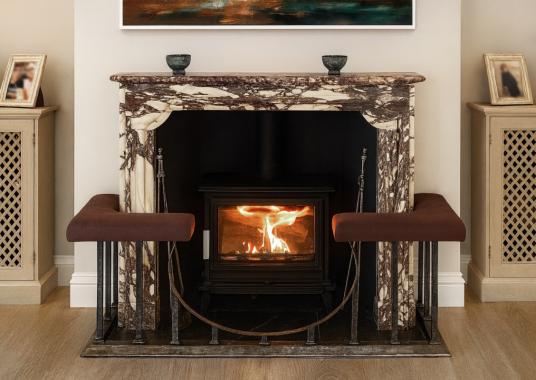 An antiqued steel club fender with leather seats