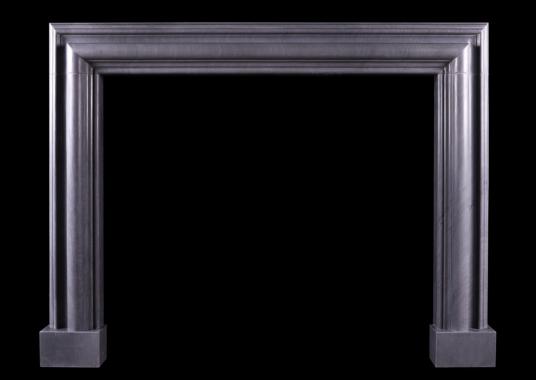 A bolection fireplace in Italian Bardiglio grey marble