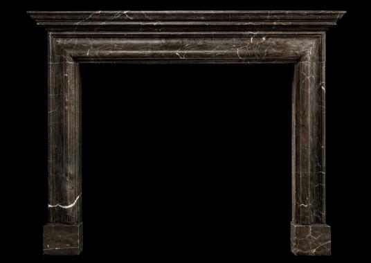 A bolection fireplace with moulded shelf