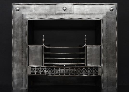 A period Georgian register grate in the manner of Robert Adam