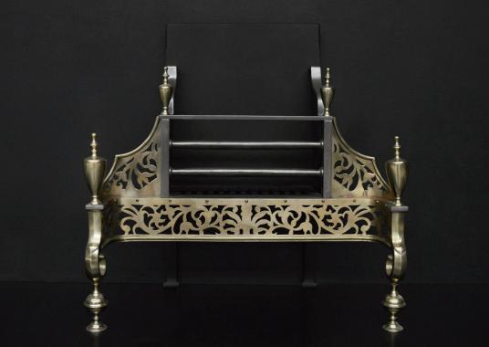 A Georgian style brass and steel firebasket