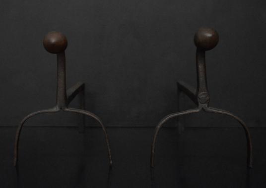 A simple pair of wrought iron firedogs