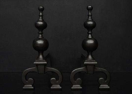 A pair of English steel firedogs