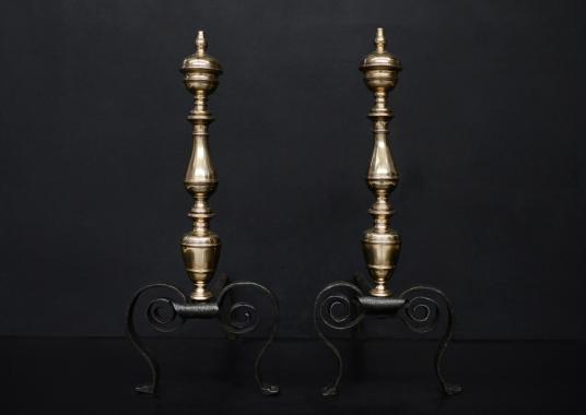 An elegant pair of brass and steel firedogs