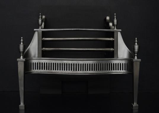 A polished steel firegrate in the Georgian style