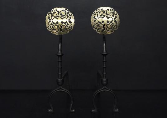 A pair of brass and steel Arts and Crafts firedogs