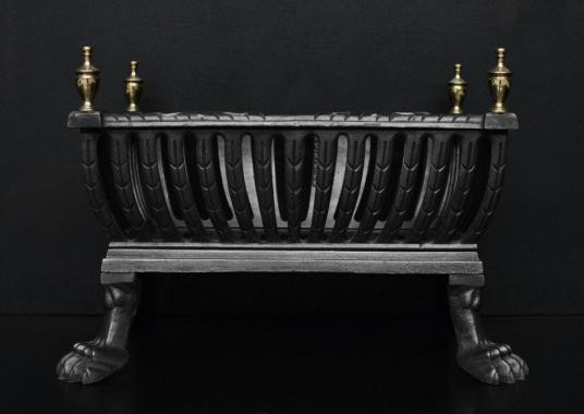 A polished iron Regency style firebasket