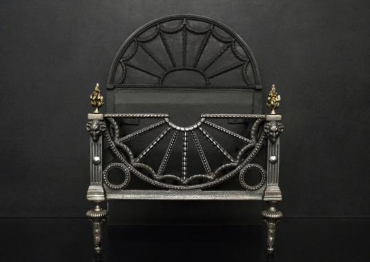 A polished cast iron firegrate in the Regency style