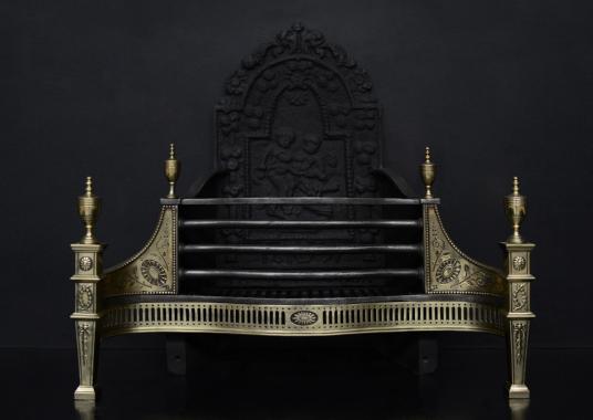 An English brass and steel firegrate in the Georgian style