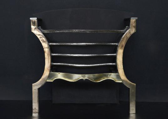 An unusual brass and steel English firegrate
