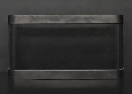 A shaped firescreen in a black lead finish