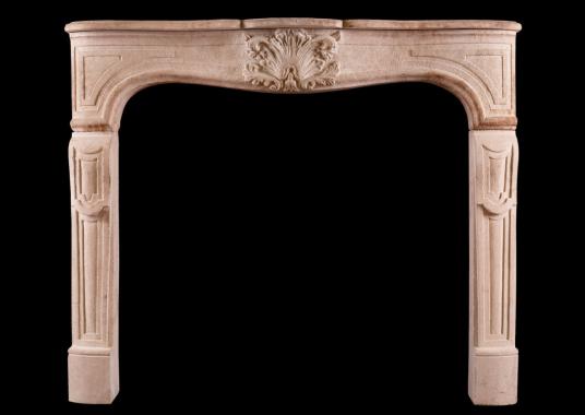 A French limestone fireplace in the Louis XV manner