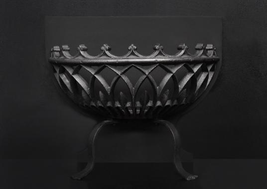 A bowed wrought iron firegrate