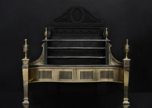 A brass and steel firegrate in the Georgian style