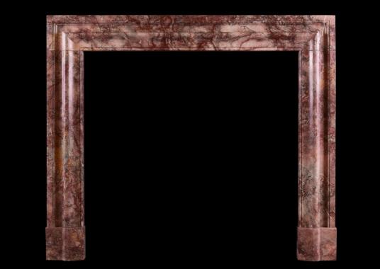 An English bolection fireplace in Fleur de P&ecirc;cher marble