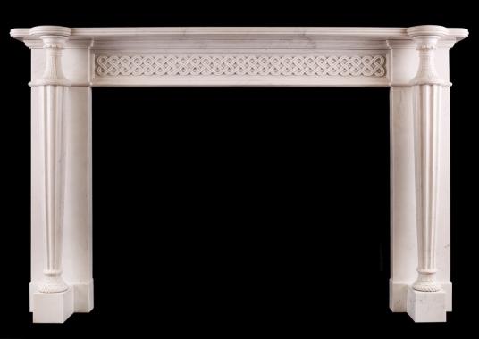 A white marble fireplace in the Regency style