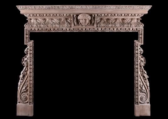 A carved pine fireplace in the George III style