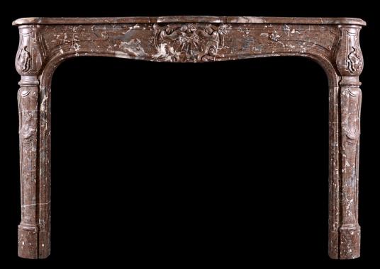 A period French marble fireplace in Languedoc marble
